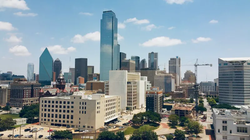 Aerial view of the Dallas skyline under a clear sky